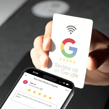 Hand holding Google NFC review card with 5-star rating displayed on smartphone screen Rating Leader